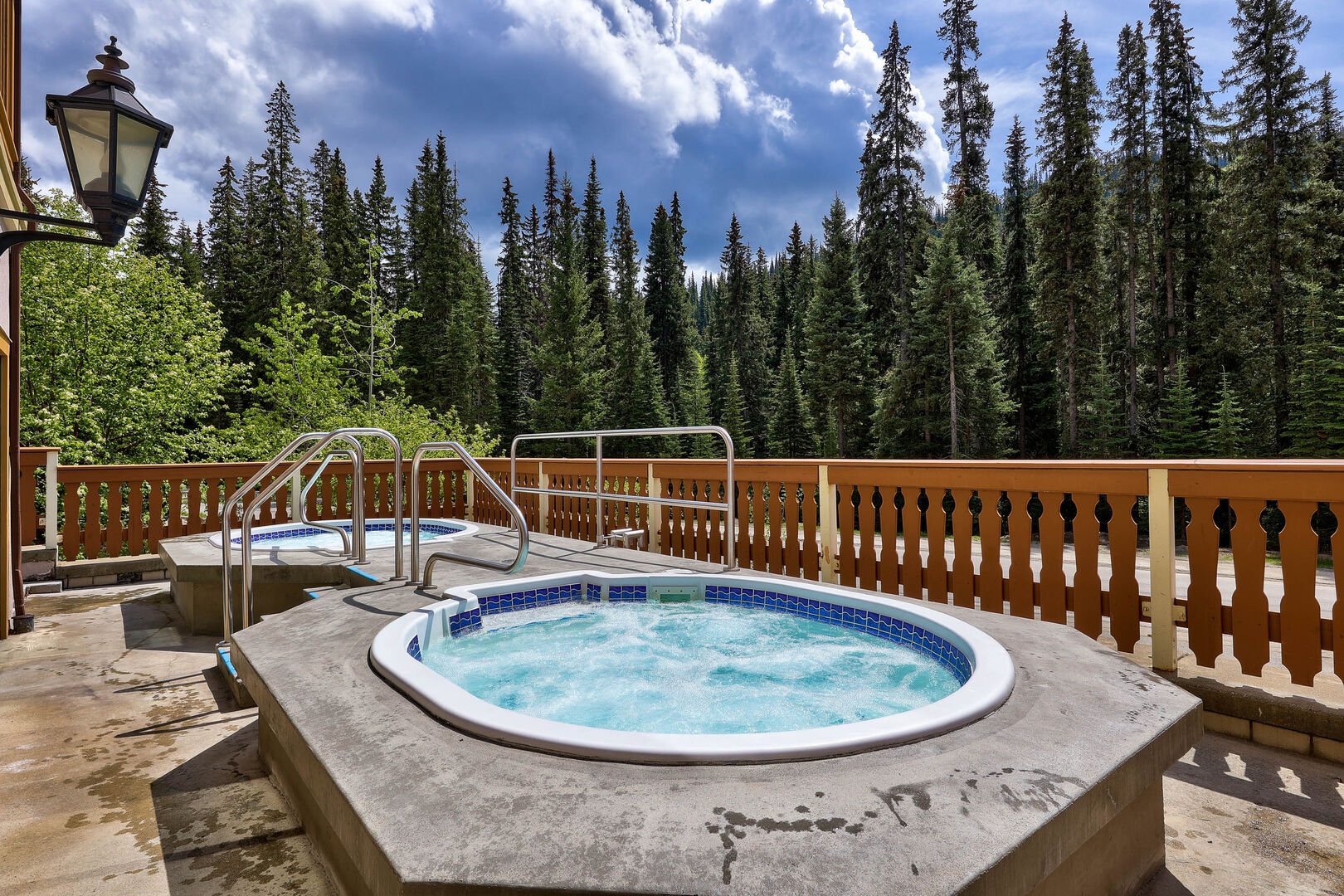 hot tubs in the hearthstone lodge with evergreen trees in the background